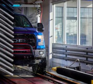blue-ford-truck-entering-car-wash-Spark-Car-Wash