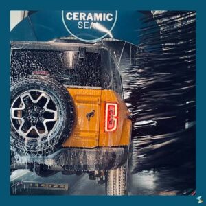orange bronco getting a ceramic seal wash - Spark Car Wash